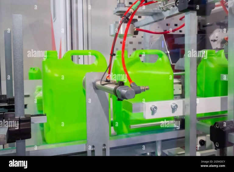 empty green plastic jerry cans moving on conveyor belt at exhibition 2G5KDCY 768x565